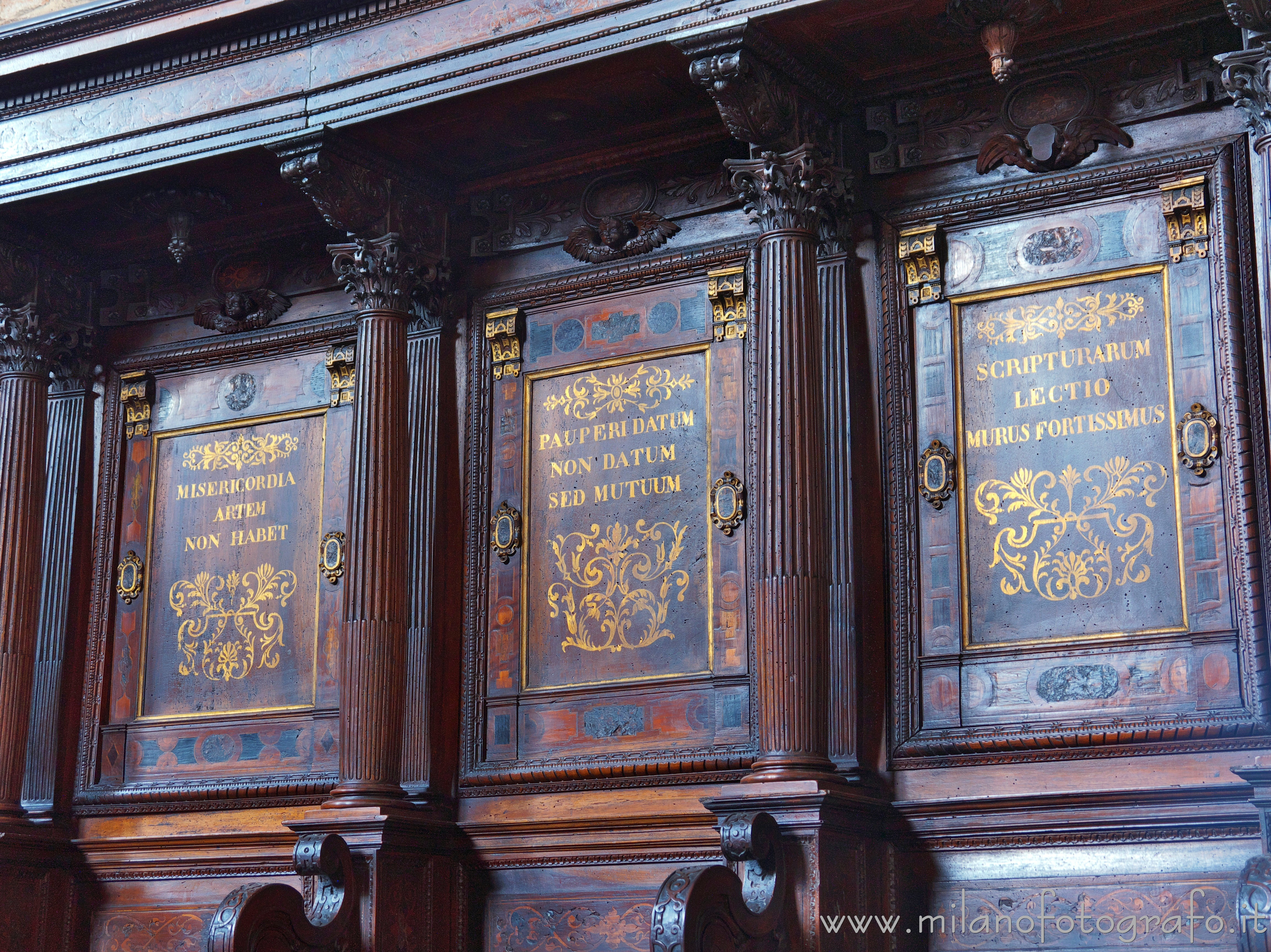 Milan (Italy) - Backrest of three seats of the choir of the Basilica of San Simpliciano - Full resolution picture
